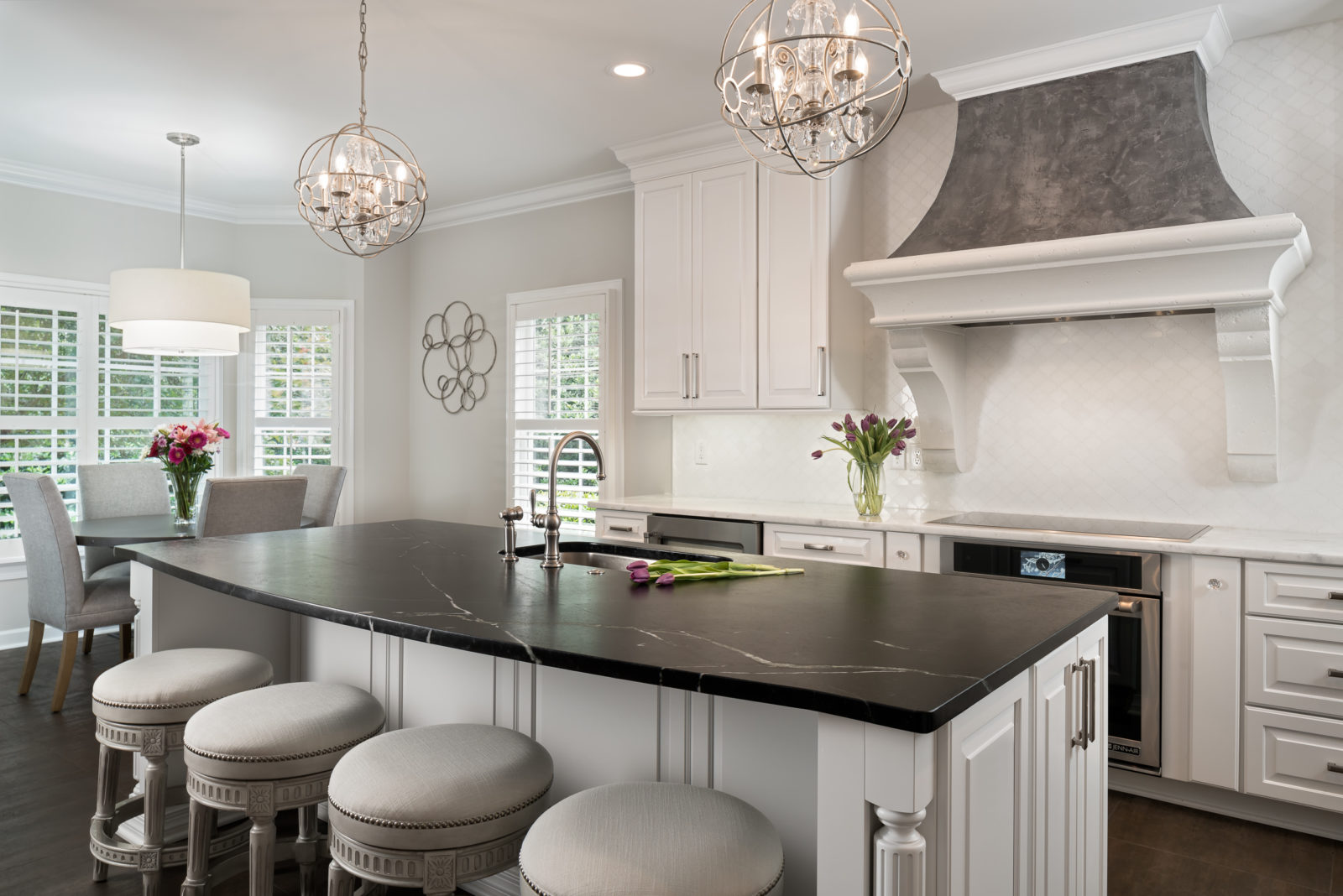 Black and white soapstone counters contrast with white cabinet in this Charlotte, NC kitchen