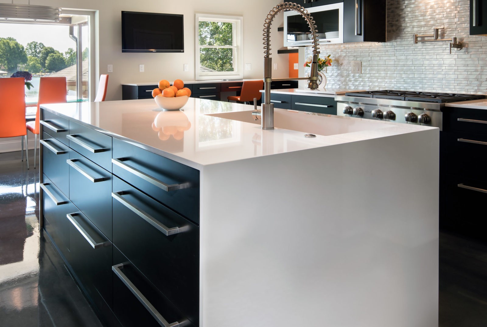 A white Silestone countertop with a waterfall edge creates a contemporary look in this Lake Norman kitchen remodel