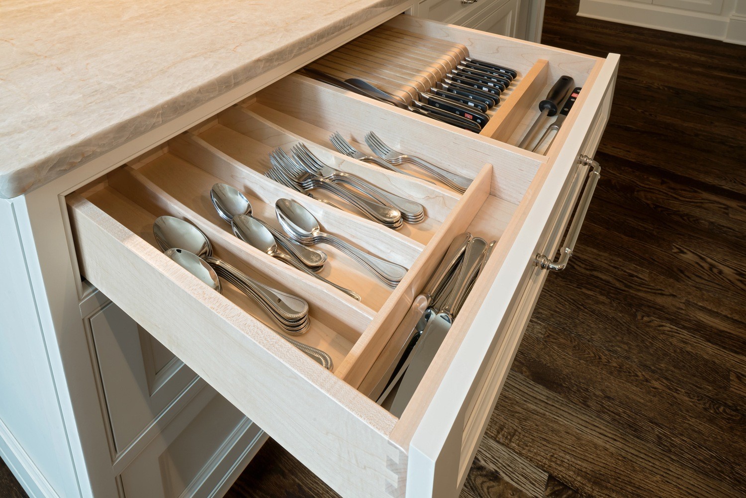 Hardwood cabinet drawers with dovetail construction and flatware storage
