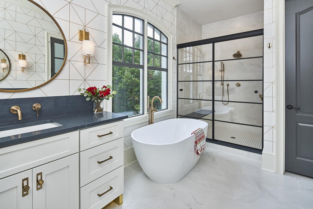 Modern, yet classic master bathroom makeover with black framed shower glass