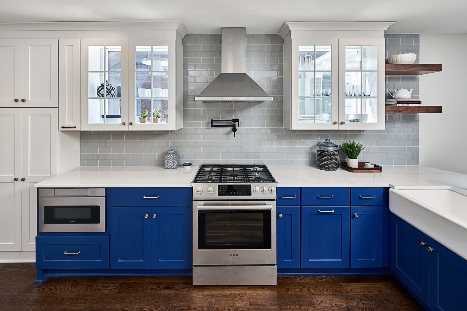 Backless wall cabinets over windows to allow natural light into kitchen