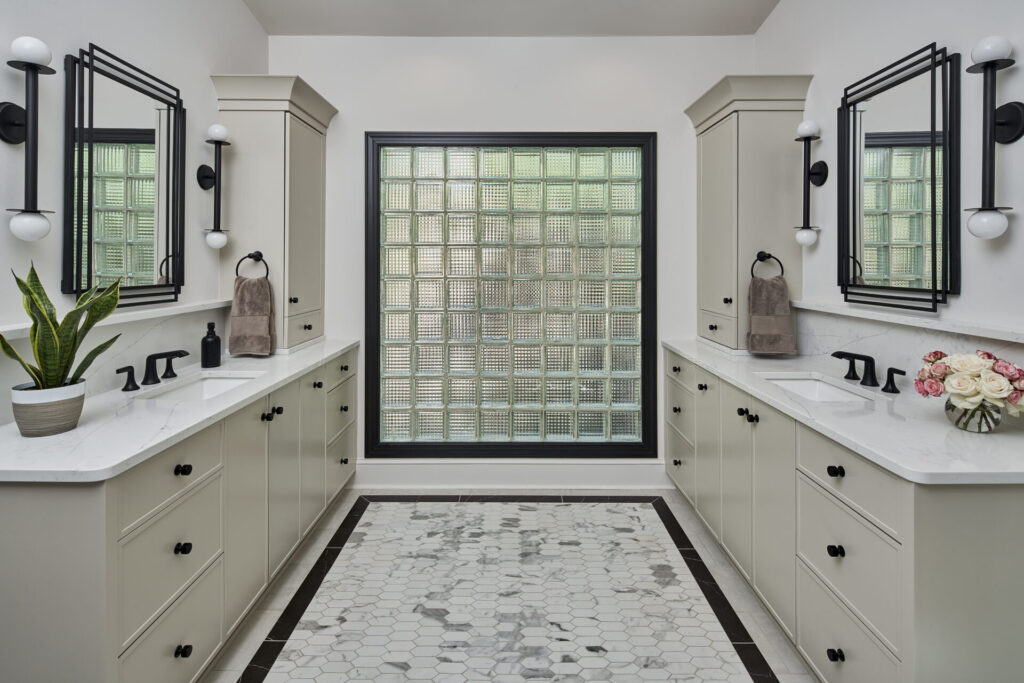 Stunning bathroom featuring a glass art deco and marble flooring.