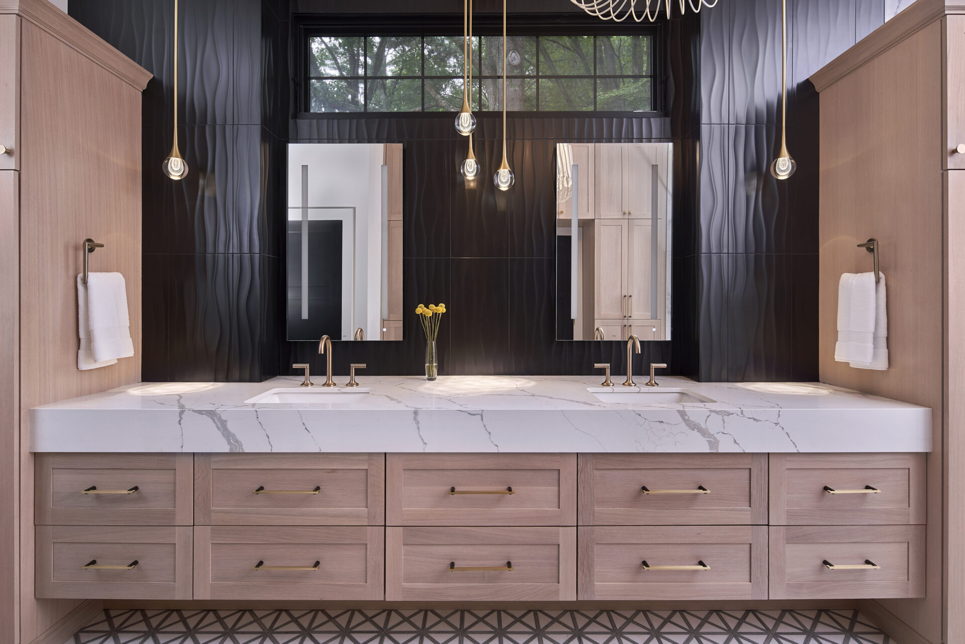 Bright minimalist bathroom with a large mirror and natural light, featuring a floating vanity and wall-mounted fixtures for space optimization.