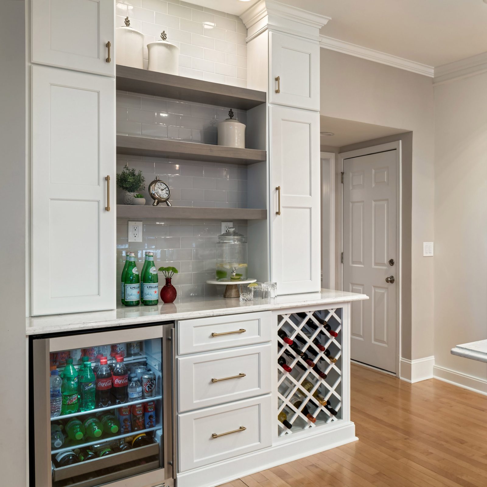 Home bar with open shelves, wine storage and white cabinets