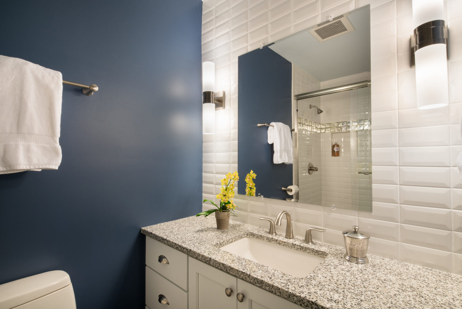 This common speckled granite was a sensible and inexpensive selection fo this little boys bathroom