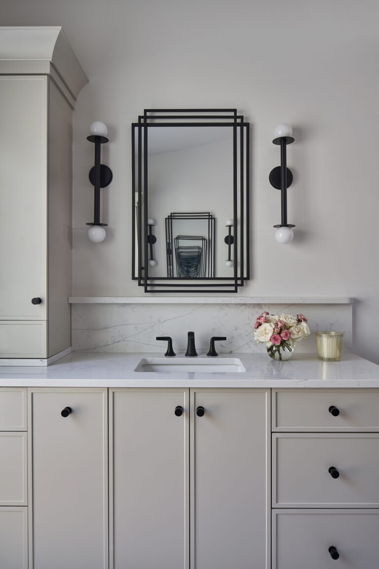 A serene spa-like bathroom counter vanity with light slim shaker cabinets.
