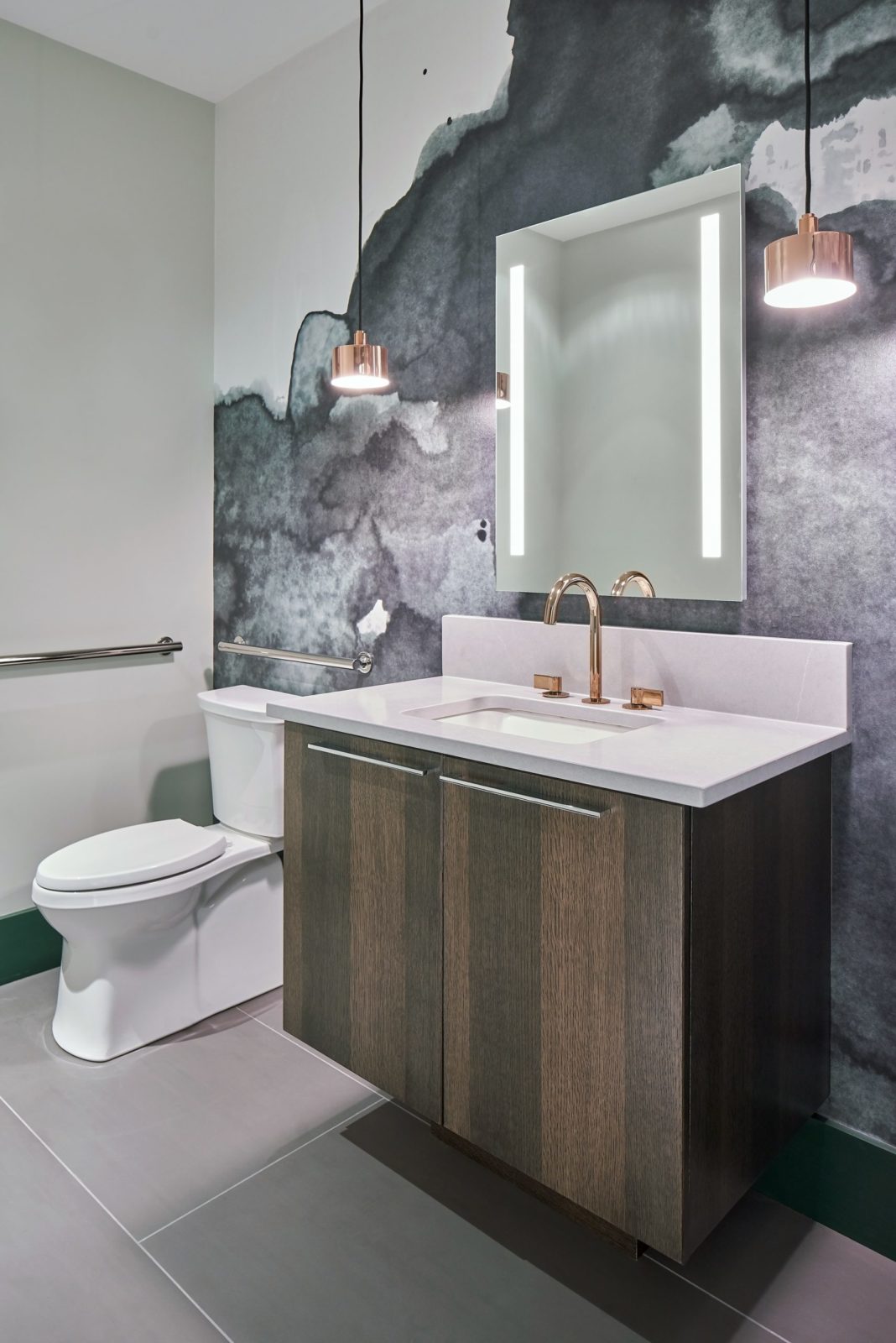Contemporary bathroom with quarter sawn white oak floating vanity, rose gold pendants and smokey green wallpaper
