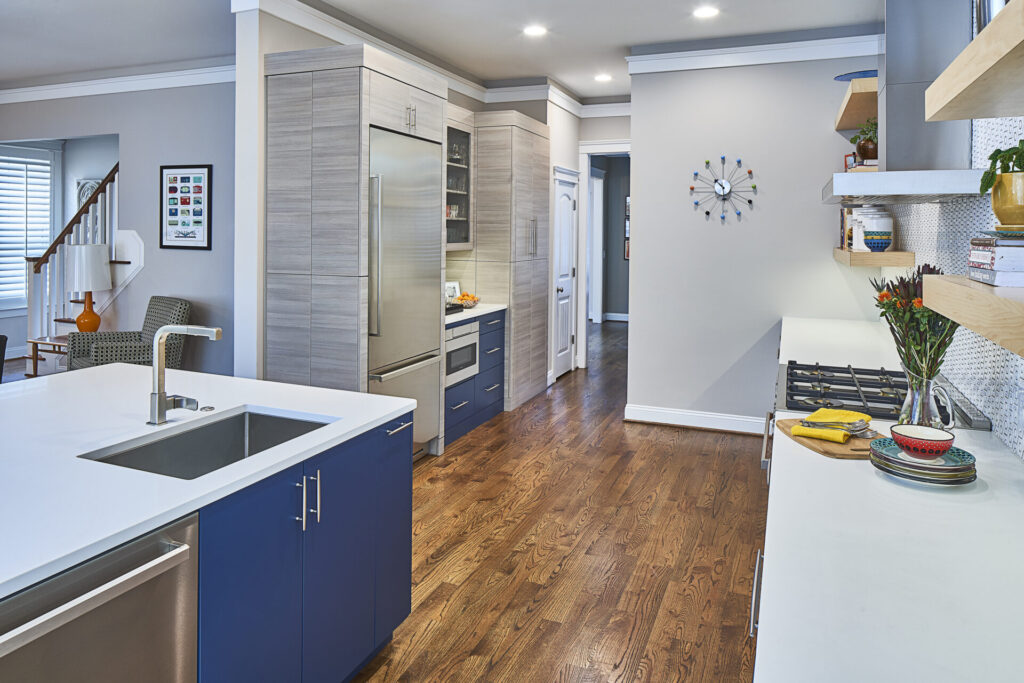 A modern, edgy kitchen with cool tones throughout and lots of counter space.