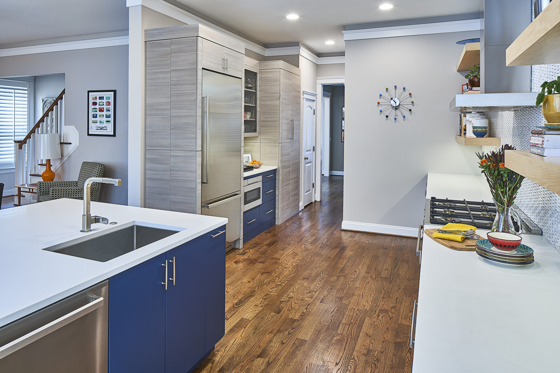 A modern, edgy kitchen with cool tones throughout and lots of counter space.