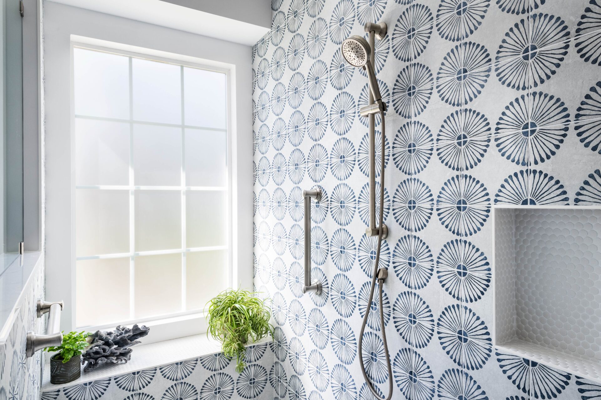 gold grab bars in a tiled shower