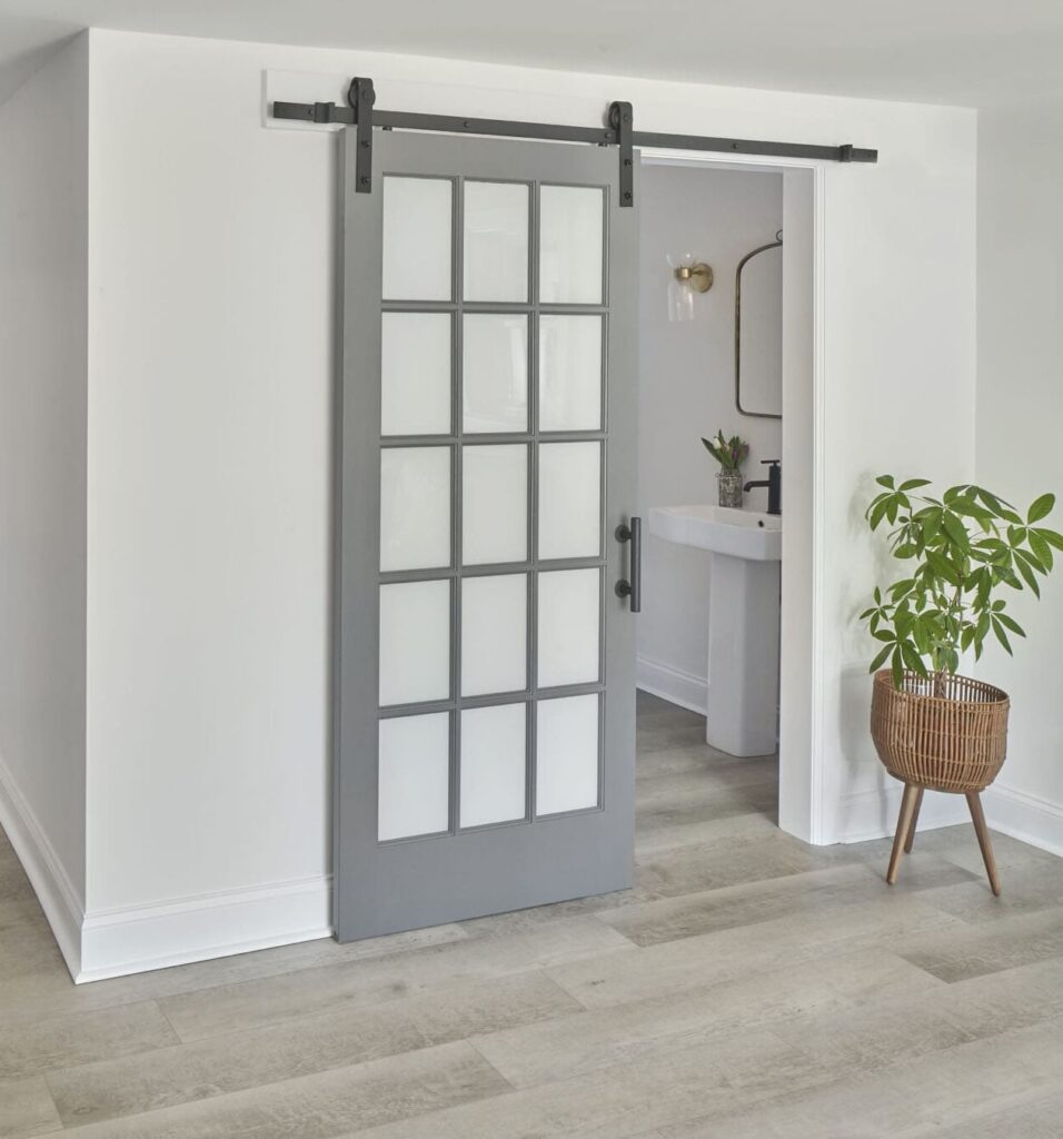 Alternate door types and floating vanities are great small bathroom design ideas.