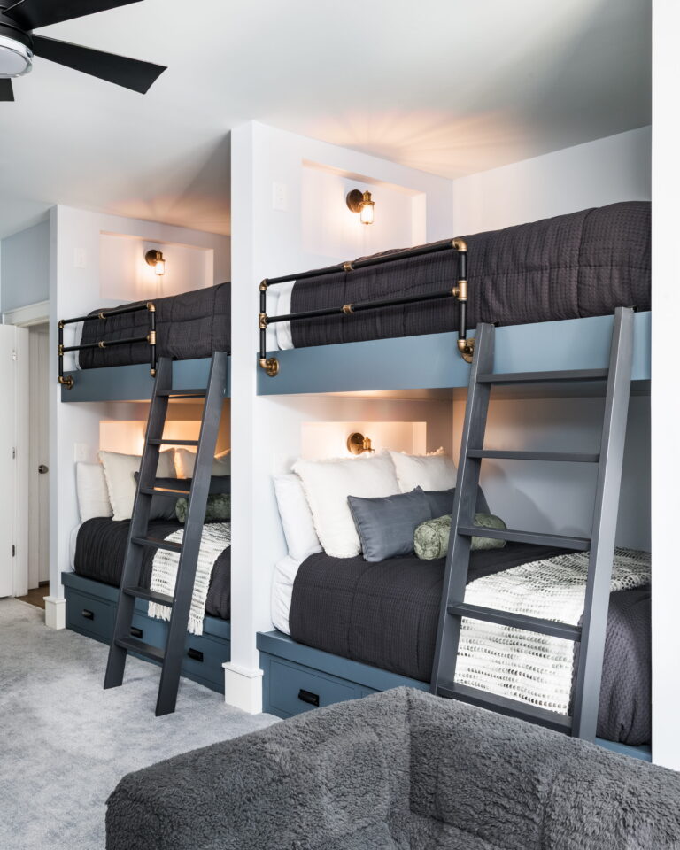 platform bunk beds with lit sconces