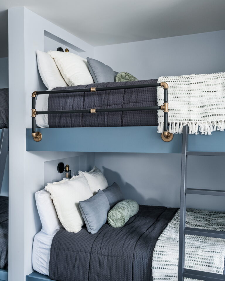 close-up of two bunk beds featuring metal railings