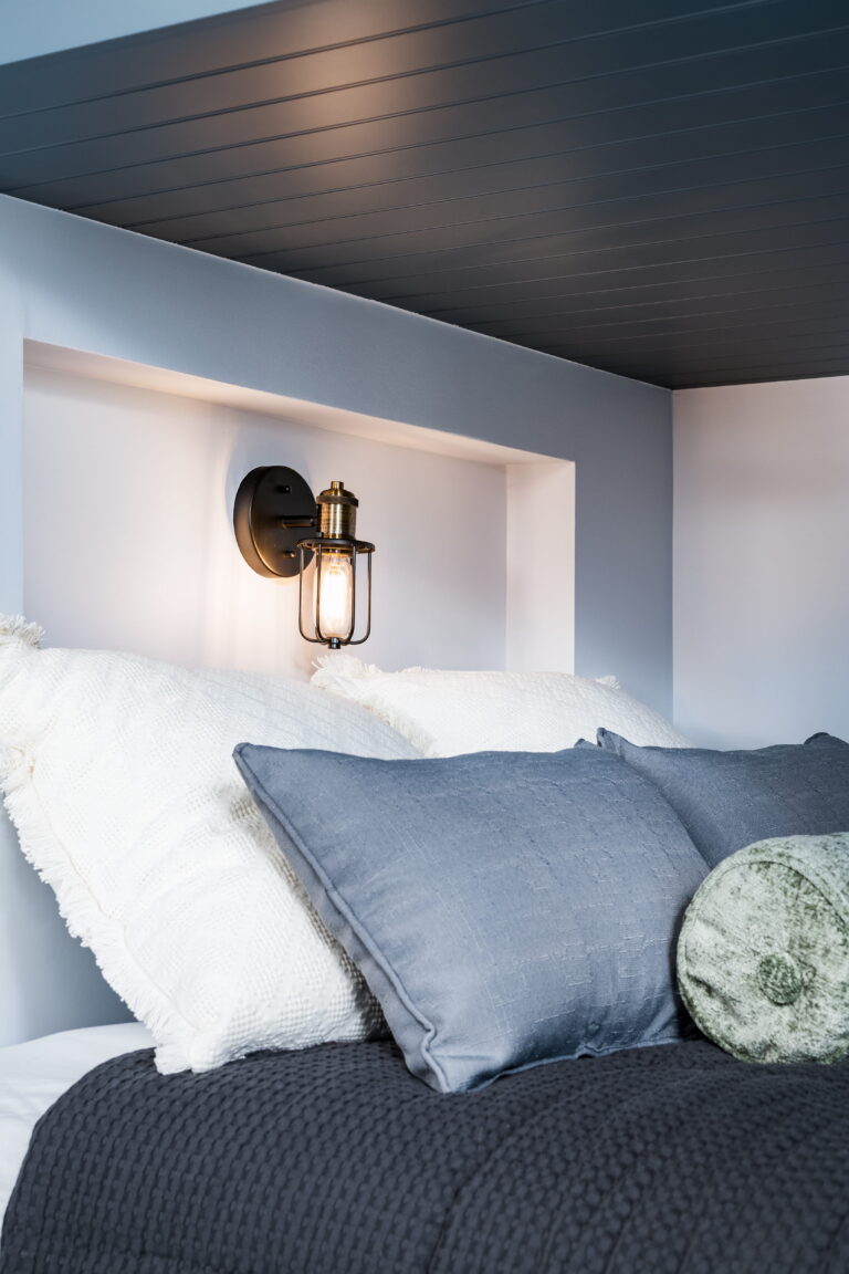 recessed niche with wall sconce